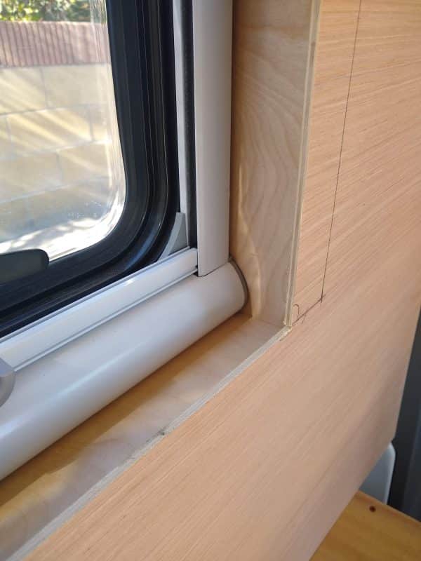 Detail Shot of Window Wall Panel Overlap DIY Camper Van Conversion